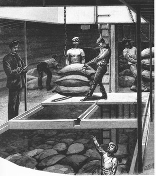 Men loading sacks into a ship's cargo hold as a supervisor is making notes or checking off the work.