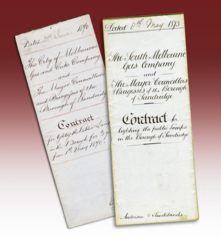 Two folded handwritten contracts.