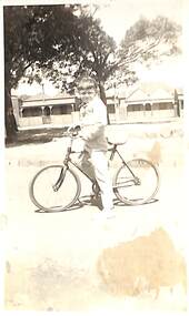 Photograph - Margaret Smith, on bicycle, Princes Street, Port Melbourne, 1940