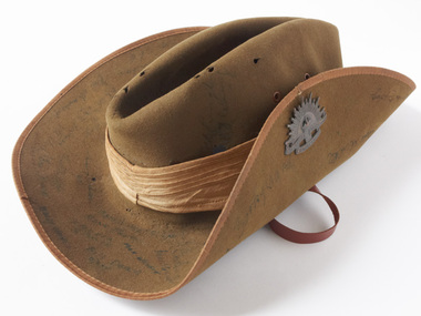 Slouch hat with faint signatures on the brim.