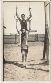 Photograph - Charles Pont (bottom) posing with gym rings on Garden City foreshore, c. 1920