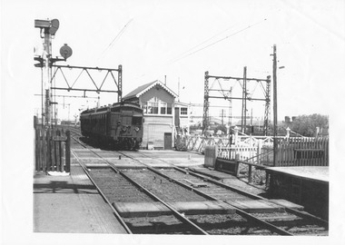 1365 - City bound two-car Tate train passing through Graham Street level crossing, 1960s