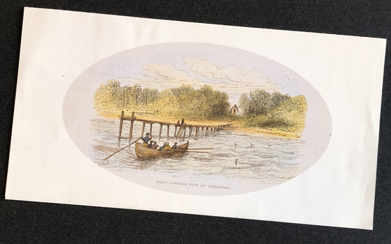 White rectangular card with an oval image of a several people in a small rowing boat approaching a simple wooden jetty leading to a small building in a cutting of the dense bush along the foreshore.
