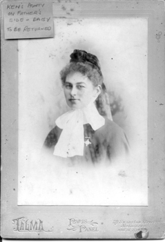 Black & white portrait of a woman in an older style nursing uniform  