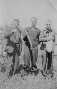 Three gentleman holding fish.