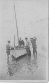 2328 - Fishermen and yacht, in shallows