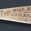 Close-up view of the engraving on the handle of the teaspoon.