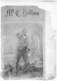 Black & white image of gentleman standing in garden early 1900's. 