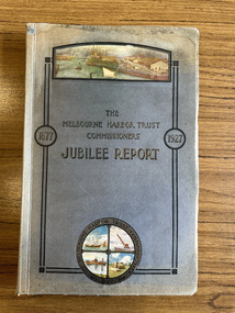 Book with a blue cover. Title and three-quarter frame in black. Colour image of a wharf scene at the top and colour version of round Melbourne Harbor Trust Commissioners crest at the bottom.