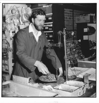 2952 - Doug Faram weighing nails at Faram Bros hardware shop, 1991