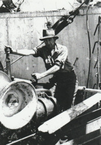 Photograph - Alex Smith, waterside worker, operating a cargo winch on Station Pier, Port Melbourne, 1940s
