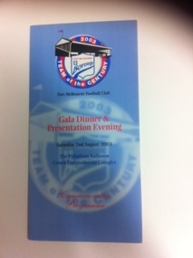 Blue coloured Commemorative programme produced for the Port Melbourne Football club Gala Dinner & Presentation Evening, Saturday 2nd August 2003, The Palladium Ballroom Crown Entertainment complex. At the top of the programme a circular red and blue striped image is shown, with the words Team of the Century within the circle, also shown is a sketch of a grandstand. In side the circle a shield is showning the words Port Melbourne Boroughs. 