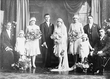 A formal portrait of a wedding party.