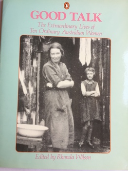 Small green book with the Penguin logan on the top of the book. The main headline is Good Talk - The extraordinary lives of ten ordinary Australian women in pink font. Underneath is a photo of a woman wearing an apron dress with her arms folded, along side her is a girl with short hair wearing a long sleeve top with a pinafore dress, her arms are folded as well. A white washing basin to the right of the woman. Underneath the photo in pink font are the words edited by Rhonda Wilson.  