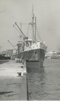 Photo shows the 'Minnipa' a cargo ship docked at one of the wharves in the Yarra River.