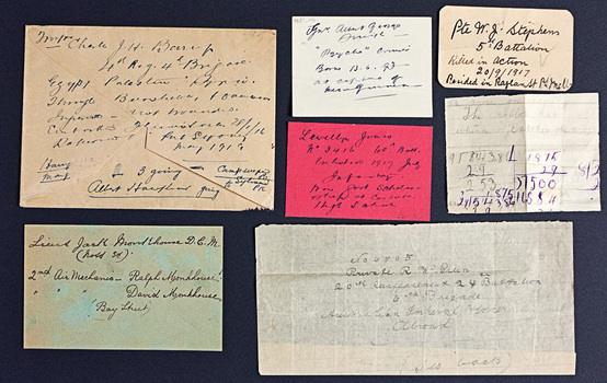 A selection of handwritten notes of varying sizes displayed neatly on a black background.
