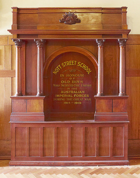 Large free standing piece of wooden furniture inscribed with words honouring the Nott Street School Old Boys who served during the Great War 1914 - 1919.