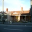 Three small partially demolished brick cottages