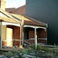 Two small partially demolished brick cottages