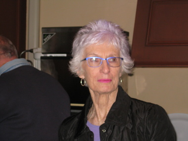 Headshot of a woman caught in a candid photograph.
