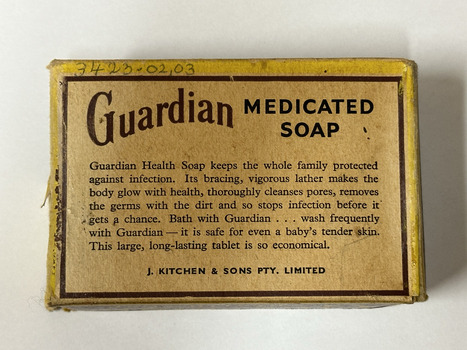 Yellow rectangular cardboard box with text relating to the benefits of Guardian Health Soap