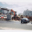 Demolition site of large building showing digger and other machinery at work.