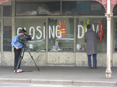 3493.09 - Filmaker, Kevin Anderson, films Doug Faram painting 'CLOSING DOWN' at Faram Bros Hardware Store