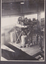 Interior of Malcolm Moore fitting shop with two workers