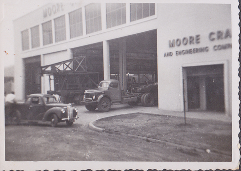 Truck and utility at entrance to Moore Cranes workshop 1959