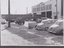 Cars in Bertie St stopped while long crane bridge is taken from workshops 1959