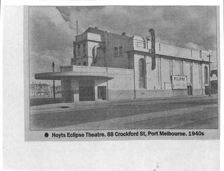 Large building with a sign on the side reading 'Hoyts' and a billboard, also on the side of the building headed 'Eclipse'.
