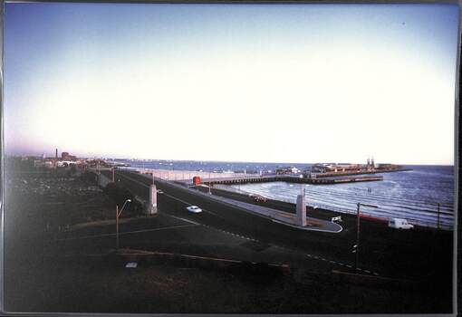 A road bridge and pier viewed from a raised position.