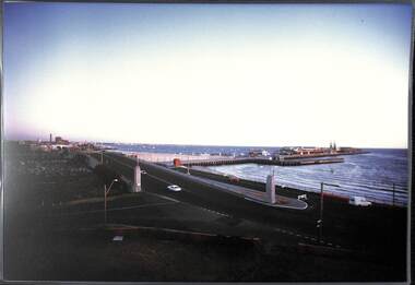 A road bridge and pier viewed from a raised position.