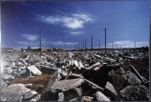 The view across a large expanse broken up concrete and rubble.