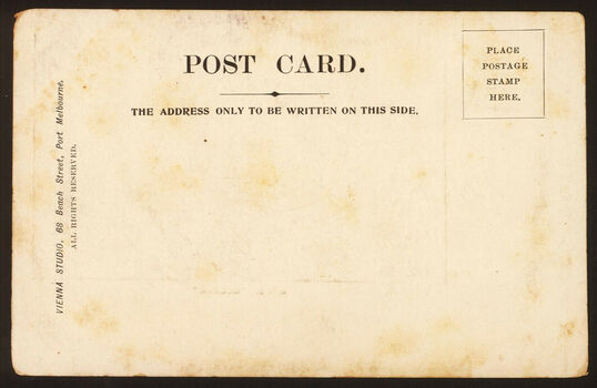 Rear view of a postcard with space for an address and a stamp.