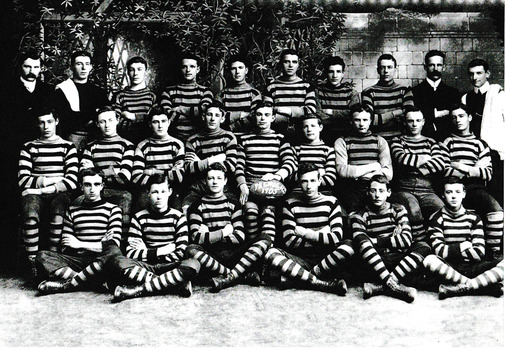 Group of men in three rows in typical football team pose.