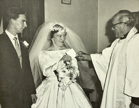 A bride and bridegroom with the minister