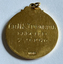 Gold-coloured medallion inscribed "Cr. N. S. Turnbull, Elected 7 - 9 - 1976"