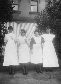 Photograph - Another four female employees in work outfits