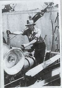 Photograph - Alec Smith operating machinery