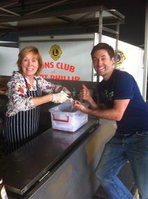 Photograph - Sue LEONG and customer, Bunnings sausage sizzle, Ann Gibson, 19 Sep 2015