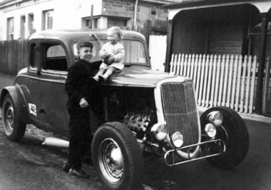 Photograph - Bill Schink with his car and baby sister, Jenny, c.1961