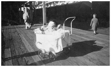 Photograph - Jenny Schink in a pram at Station Pier, 1959