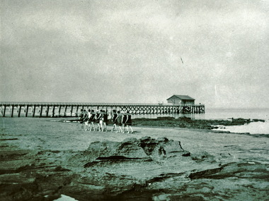 Lifesavers and jetty at front beach Queenscliff