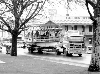 Golden City steamer passes Golden City Hotel