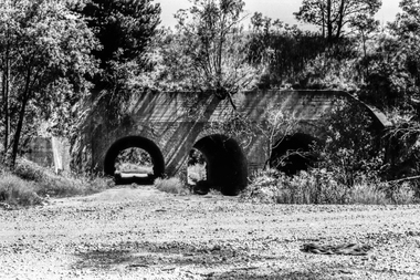 Film - Photograph by Herb Richmond. ca 1971, Creswick- Three Arch Bridge carrying the railway embankment. Two traffic lanes and a waterway. West of Creswick off the road to Bald Hills