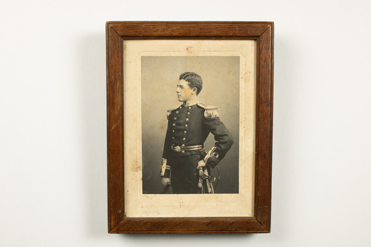 Portrait of a young man in naval ceremonial uniform.