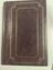 Cover of brown photo album with gold embossing.