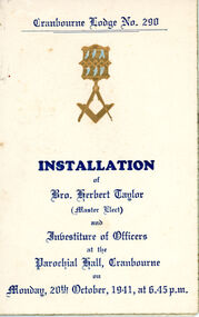 Front cover of program, gold embossed square and compass.
