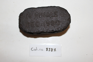 Inscribed coal briquette
